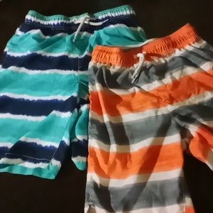 Two children's place swim trunks